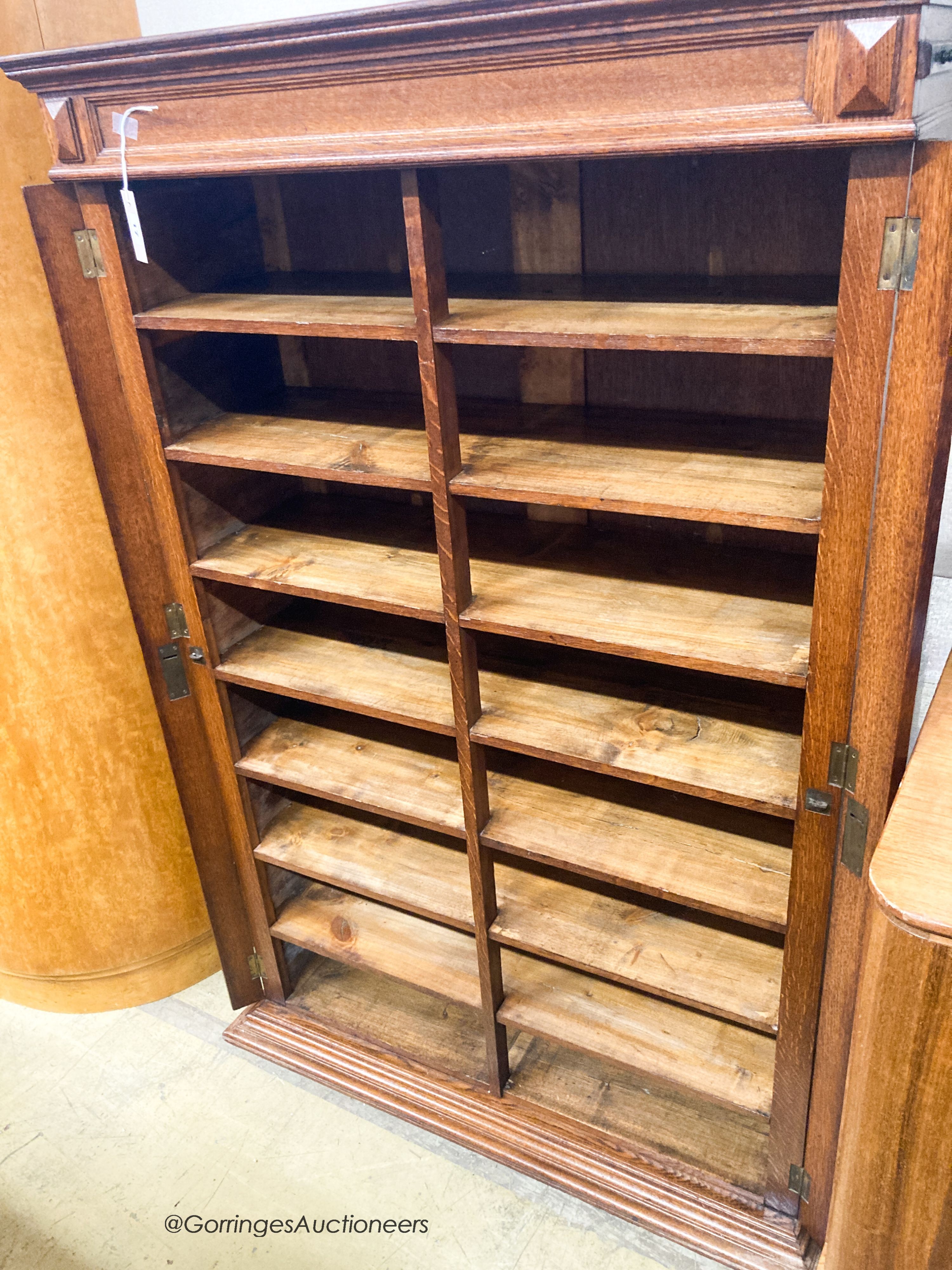 An early 20th century oak sixteen division office cabinet, W.92cm D.36cm H.150cm